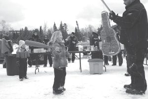 Kids had a great time trying to break the piñata— and catching all the candy that tumbled out onto the snow.