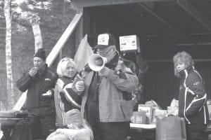 Above: There were great door prizes. Helping with the distribution were (L-R) Lee Jahnke, Barb Gervais, Emcee Snowmobile Doctor Jerry Gervais, Kathy Buckman.