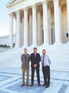 Two former Sawbill Canoe Outfitters staffers traveled to Washington, D.C. to lend support to Adam Hansen as the workers’rights case he participated in was heard by the Supreme Court. Pictured in front of the Supreme Court building are (L-R) Max Wilson, who is now an attorney working in Washington, D.C., Hansen, and Nathan TerBeest, a school administrator in Omaha, Nebraska. Also attending the hearing was Hansen’s girlfriend, Lisa Burtch, and his Nichols Kaster supervisor Paul Lukas.