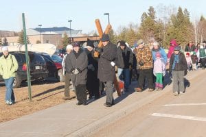 The Good Friday Community Cross Procession was well-attended by members of many community churches. The processional started and ended at St. John’s Catholic Church where Father Seamus Walsh gave a community Good Friday homily. Pastor Mark Ditmanson carries the cross from St. John’s to his congregation, Bethlehem Lutheran Church.