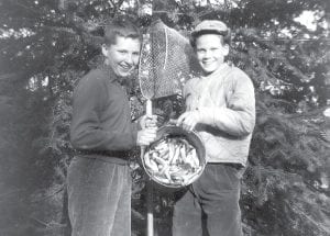 “Going smelting” was a popular community event in the 1960s and 1970s. Dozens of people would gather at river mouths along the North Shore to net the tiny silver fish for smelt fries. The smelt population has declined significantly but many remember the heydays, such as these young men— Clifford Berglund (left) and Glenn Larsen. The photo was taken near the Devil Track River by Evelyn Larsen, circa 1960-61.