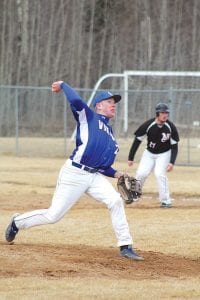 Left: In full wind up, Viking pitcher Travis Bradley threw a fastball by the McGregor batter. Bradley went the distance, giving up five hits and three runs while striking out seven and walking five on a cold, windy day. Above: Leo Jonson slid under the catcher’s tag to score a run for the Vikings who won their season opener 12-3 against the Mercuries.