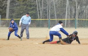 Above: With Carrie Palmer looking on, Jami Sjogren put the tag on the McGregor Mercuries’ runner. The Vikings played McGregor on April 7 at the Grand Marais Recreation Park in freezing conditions and beat McGregor by a score of 11-0. Upper right: Trace McQuatters pounded this pitch for a hit. Lower right: Mariah Deschampe gloves a low throw and steps on first base for the out.