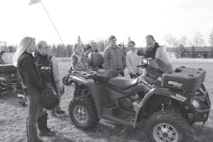 An important part of the Minnesota Department of Natural Resources youth ATV safety training is getting to know how an all-terrain vehicle operates. Volunteer instructor Gideon Silence talks to last year’s class before the field test. Youths can sign up for the 2015 class now.