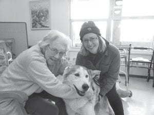 April was Dog Appreciation Month. The residents enjoyed a visit with Phoenix, a Hedlund Husky from Points Unknown: Dog-Based Adventures in Hovland. Phoenix is a lead sled dog and two of his puppies also visit the Care Center. (L-R) Helene Smith, Phoenix and owner Linda Newman.