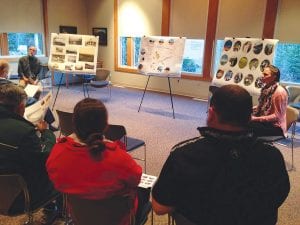 Grand Portage National Monument Superintendent Tim Cochrane and Senior Resource Planner Kelley Wilder of The 106 Group in St. Paul, listen as community members share their thoughts about the historic meadow area.