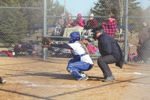 The Vikings' backstop Maddy Roy calls for the pitch from Alex Slanga. As the catcher, Roy is like the quarterback of the team. In addition to defense, Roy also leads the team with her bat.