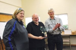 This year’s recipient of the Dolly Johnson Friend of Emergency Services Award was Cook County Sheriff’s Department dispatcher Doug Gale. (L-R) Dolly Johnson’s daughter Kelly Roberts, Doug Gale, Emergency Services Director Jim Wiinanen presented the award at the Saturday night banquet.