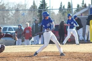 As Jaret Baker warms up in the background, Richie Furlong takes his turn at the plate. The Viking catcher smacked a single in a game played against Two Harbors that the Vikings won. Richie was also one of three Vikings to get a hit against Moose Lake/Willow River.