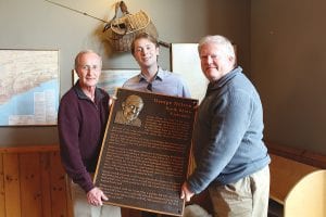 The Lutsen Villa Association wanted to do something special to remember the founder of the Sea Villas—and their friend—George “Bub” Nelson. They had this stunning bronze casting made which will hang in the Sea Villas registration and pool building. On hand at the unveiling were Leonard “Bud” Nordstrom, president of the Lutsen Villa Association; George Nelson’s grandson Alden Harris; and Mike Winegar, Lutsen Villa Association past president.