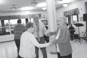 The North Shore Care Center celebrated its 50th anniversary with a Gala, which included music by Doug Sanders, followed by the North Shore Community Band. Left: Nurse Tim Young got Marigold Linnell and Marie Jacobson up dancing and laughing. Above: Care Center Activities Director Kay Rosenthal enjoys swing dancing with resident Lorraine Wipson.