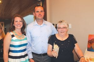 Birch Grove Community School Board Members Jessica Cameron, Plamen Dimitrova, and Judy Motschenbacher had fun announcing the raffle winners.