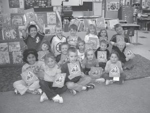 This photo from the Cook County Star issue of December 8, 2003 was captioned: Sawtooth Mountain Elementary first graders recently received an unexpected gift from local businesses. Students each received a copy of “My Favorite Book,” which will be shared in class together. (L-R, front) Madeline Young, Morgan O’Leary, Zack Anderson, Selien Morawitz, Ashley Berglund. (L-R, middle) Mikala Schliep, Aaron Breitsprecher, Carolina Palmer, Nate Carlson, Noah Warren. (L-R, back) Rusty Day, Lars Scannell, Kody Cronberg, Amy Yule, Brenna Hay, Devyn Deschampe. (Not pictured - Josie Freeburg, Sam Gearou, Josh Gearou, Jamie Wick).