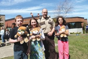 Special recognition went to three students, pictured here with Deputy Hallberg—Poster Contest winner Johnathan Huskey and the students who read their essays at the graduation, Olivia Nesgoda and Christiana Mendivil.