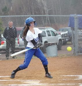 With her eye firmly on the ball, Bethany Derscheid gets set to punch a single into the outfield in a recent home game.