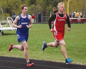 Above: Roman Schnobrich tries to overtake the Cromwell runner just ahead of him. Schnobrich was also part of the Vikings' 4x800 relay team that took fourth at the conference meet. Right: Trent Spry drove to the tape in the mile run, crossing the line in 6:29, a new personal record for him.