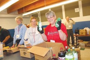 Volunteers cheerfully helped pass out the “abundance of food” distributed at Cook County’s first Ruby’s Pantry event at School District 166. Although the line of nearly 400 people was long, it went fast and no one seemed to mind.