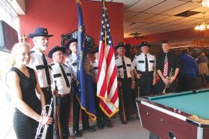 The American Legion Post 413 Memorial Day ceremony was held inside because of a steady downpour on May 25, but it was meaningful just the same. The Post 413 Honor Guard was there, along with Cook County High School band members Libby Zafft (on left) and Owen Anderson (far right). The band students played Taps at the end of the ceremony.