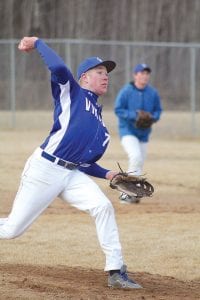 Left: Travis Bradley pitched a one-hit shutout against Carlton to help lead the Vikings into the third game of the Section 7A playoffs. Above: Leo Johnson goes to work with his bat against Carlton. Leo was the winning pitcher in the earlier game against McGregor/Cromwell.