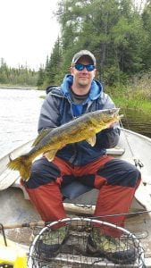 Pete Bartley of Lutsen shows off the nice walleye he caught while fishing with Captain Kelly Shepard of North Shore Outdoor on Sunday, May 31. This is the biggest catch of the day at 28 inches long. The men were fishing in a lake near Grand Marais.