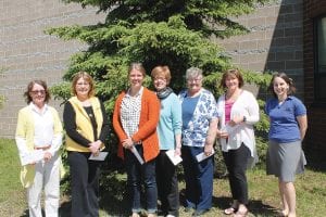 A highlight of the Arrowhead Electric Cooperative annual meeting is the presentation of donations to community nonprofits through the co-op’s Operation Round Up program. Accepting checks for the organizations they work or volunteer with were (L-R) Jetty St. John, Gwen Carman, Caroline Fritz, Jodi Yuhasey, Sharon Bloomquist, Jeanne Anderson and Sara McManus. McManus had the honor of presenting the grants.