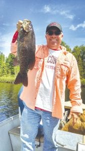 Bill Torhorst of Oregon, Wisconsin caught this nice 21-inch smallmouth bass on a jig and a minnow right beside the boat while fishing on an inland lake with Joe Carlson of Joe’s Inland Guide Service last week.