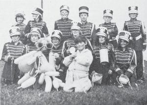 This crew, the Fat Man Circus Band, equipped with fife and drums, flutes and a xylophone, won the grand prize in the 1980 Fourth of July Kiddie Parade in Grand Marais. They are, first row from left, Ronnie Wilson and Kent Anderson; second row, Kris Smith, Julie Eliasen, Jennie Hellmers, Beverly Adams, Cheryl Antoniak and Lori Burnett; back row, Katie Nelson, Dawn Drouillard, Tim Quaife, Eric Nelson, Greg Monson and Jeff Eliasen. The band uniforms were borrowed from the school.