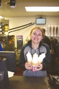 Emma Olfson holds three cones she made in the ”Top Curl” competition held at the Grand Marais Dairy Queen last week.