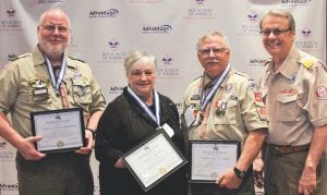 Three Northland Boy Scout leaders were recognized with the Silver Beaver Award by national Chief Scout Executive Wayne Brock, far right, during a dinner for the Scouts’ Voyageurs Area Council in Duluth May 6. The award winners are (L-R) Patrick Baumann of Virginia, Elaine Hansen of Duluth and Dan Baumann of Grand Marais.