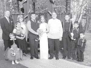 (L-R, front) Kaylee Olson, Wei-Lani Likiaksa, Groom and Bride Darren and Eden, Bill Hinrichsen, Trent Spry, Caiden Spry, Dwight Likiaksa. Back: Jerry Waha and Sharon Olson.