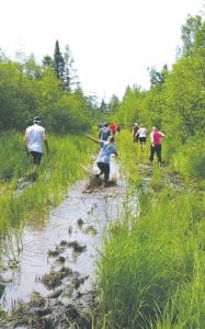 Annika Arvidson, No. 170, of Golden Valley, Minnesota, was a race walker, but she tried running through this puddle to get through it quickly. She made it without falling down!