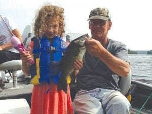 Emilia Leggett, 5, of Rochester, Minnesota caught this 17¾- inch bass in an area lake using her pink Cinderella pole. She was fishing with her dad and brother, Cadman and Adriano. Fishing guide Joe Carlson of Joe’s Inland Guide Service (with Emilia) said she landed the big fish with very little help.