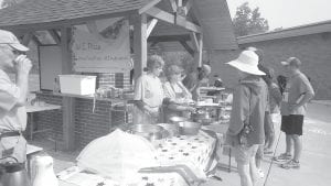 Community volunteers manned the Birch Grove wood-fired pizza oven at the Tofte Trek on the 4th of July.