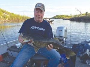 Marco Manzo III of Sagonto Resort sent the Cook County News-Herald some fishing news from Saganaga Lake. Randy Denzer from Amery, Wisconsin, who has a cabin on Lake Saganaga, stopped by the resort to show photos of two very nice walleye catches. On May 23, he caught this 32-inch, 12-pound walleye. Before releasing it, he managed a fishing solo-selfie.