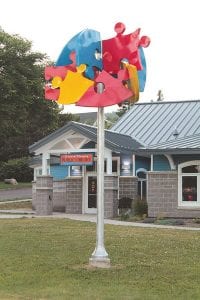 The colorful sculpture in front of the Grand Marais Library now has a name. The library Art Committee chose a name that was submitted by six different people, The Puzzle Tree.