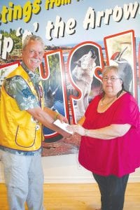 The Grand Marais Lions Club donated $4,000 to the Cook County Historical Society to use for the restoration of the Bally Blacksmith shop. Lion Max Bichel presented the check to Cook County Historical Society president Alta McQuatters. McQuatters thanked the Lions for their gift and their ongoing support of the historical society. Three generations of the Bally family ran the blacksmith shop for 94 years. In 1986 it was placed on the National Register of Historic Places. In 2010 Bill Bally passed away and a great blacksmith (and man) was lost to the area.