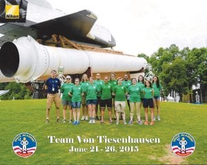 Haylie Anderson of Grand Marais joined a team of 13 Girl Scouts at the U.S. Space and Rocket Center in Huntsville, Alabama for SPACE CAMP®. Above: Haylie (4th from left) with her “crew” outside the International Space Station (ISS) simulator. Left: One of the challenges was building a rocket that could protect its passenger (an egg) when fired 10-40 feet in the air.