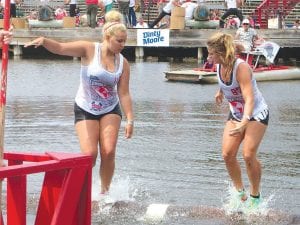 Above: Wellesley Howard- Larsen (L) and Lily Duffy rolled an exciting match for third place in the Women’s Semi-Pro division at the Hayward Lumberjack World Championships. Duffy, from Hayward, was down 2 falls to 1 and came back to beat Howard-Larsen 3-2. Left: Lexi Plummer had a tremendous tournament, finishing fourth at Worlds in the U-7 division. Here she rolled one of her competitors into the Namekagon River.