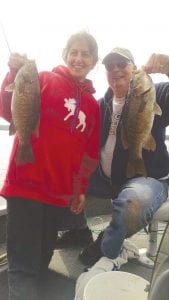 Lena and Del Zelenograd hooked these two small-mouth bass at the same time. One was 16½ inches and one was 17¾ inches. Lana is from Russia. She is Del’s daughter-in-law. Del is from Sioux Falls, South Dakota.