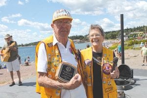 The 2015 Cook County Senior Citizen of the Year Walt Mianowski shed his Duffer the Clown persona to accept the award from Lion Rosemary Lamson on the Harbor Park stage on Saturday, August 1.