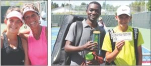 Above left: Kimberly Christopher edged Lisa Topp out of the Women’s Open Singles championship, but the finalists were all smiles after the tough match. Above: The finalists in the Men’s 3.5 Singles, Bondo Nyembwe of Thunder Bay and Bryce Dodak of Vadnais Heights, Minnesota, show off their tournament winnings. Dodak was the champion. Left: A very determined Rohan Rakshit of Thunder Bay won the Men’s Open Singles match.