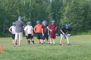 There was very little standing around on the Vikings’ first day of football practice, but in certain moments Head Coach Mitch Dorr would stop the action and address his players, explaining a new drill or his expectations. The Vikings have 10 days to prepare for their first 9-man game, which will be played at home on Saturday, August 22 at 2 p.m.