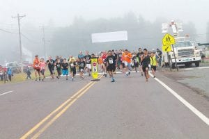 Top: Runners take off in the 25th annual Rendezvous Days Run-Walk. Left: A previous director of Grand Portage Health Services, Michelle Backes-Fogelberg, returned for the celebration. Above middle: Health Services honored Irene Deschampe, one of the founders of the popular Run-Walk. Above right: These runners are sporting T-shirts with the special 25th anniversary design.