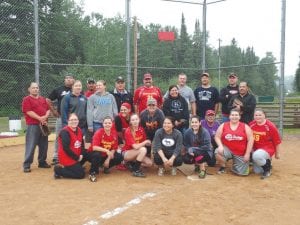 Fans needed umbrellas in the stands during the wet and wild Old Timers Game on Friday, August 7. The Old Timers played the Women All Stars and won. One player commented, “It was the best game ever!”