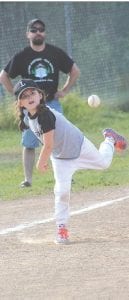 Left: With a smile lighting up his face, Waylon practices throwing and playing catch before a T-ball game. Above: Will she be the next Mo’ne Davis? Who knows, but Grace is showing good form in this Parent Pitch game and she’s got a couple of years to grow her game.