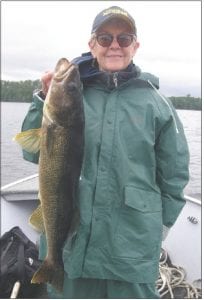 Gail Englund had a fantastic day of fishing with Mike Berg of Seagull Creek Fishing Camp on the Gunflint Trail. They traveled to Northern Light Lake, Ontario on a gray and drizzly day, but it was worth it. Gail caught and released a 30-inch and 28-inch hog walleye, plus filled her limit of 17- inch eaters. Gail called it, “A day in paradise!”