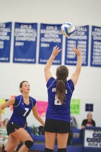 Above: Alex Slanga (8) sets the ball to Linden Sutton (7) who hammered it home for a Viking point. The Vikings beat Duluth Marshall 3 games to 1. Upper right: Raina Ryden hit the floor to set this ball to her front line. Right: With Lily Gruber-Schulz (10) looking on, Maddy Roy (14) tips the ball over the net to Marshall.