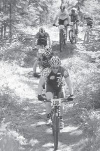 Sawtooth Mountain Bike Challenge race coordinators have moved the event back a month this year in the hopes of attracting more entrants. Above, a group of riders earnestly pedaled the beautifully wooded trails of Pincushion Mountains in their quest for a top place in last year’s sport race.