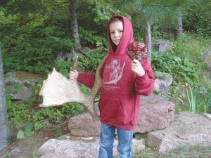 Patrick Erickson, 9, from Monticello, Minnesota came for a long weekend to find moose sheds. And unbelievably, he did. Between Greenwood and Carrot lake and over four miles of old trails and in the pouring rain, he found this moose antler shed as well as a magenta shelf fungi.