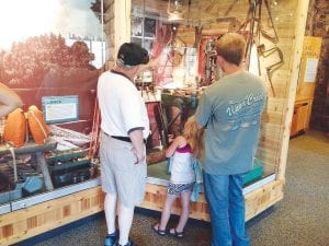 Attendees at the Gunflint Trail Historical Society (GTHS) annual pie and ice cream social on Saturday, September 5 also enjoyed the Chik-Wauk Museum exhibits. Above: Museum Director Bonnie Schudy had a very busy day.